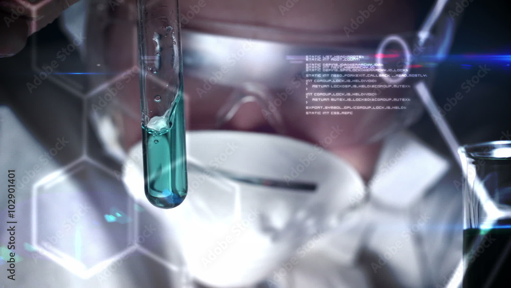 Scientist checking a liquid in a test tube Scientist checking a liquid in a test tube