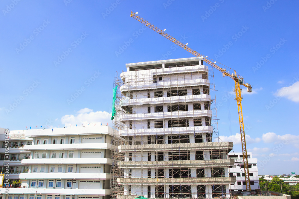 Building under construction tower with crane