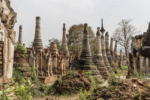 Ruins of ancient Burmese Buddhist pagodas Nyaung Ohak in the village of Indein on Inlay Lake in Shan State, Myanmar (Burma). photo