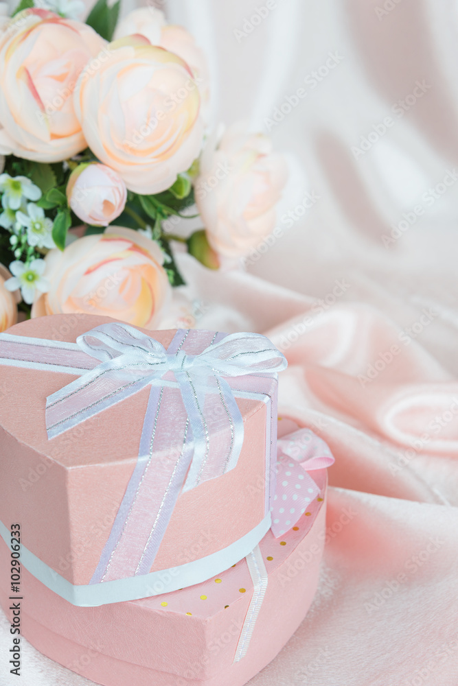 Festive composition with camellias and gift box Festive composition with camellias and gift box