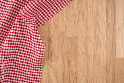 the checkered tablecloth on wooden table