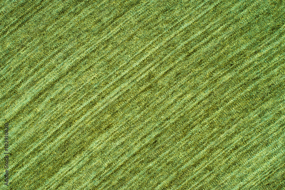 close up of a green knitted fabric close up of a green knitted fabric