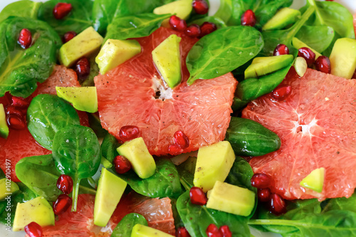 Healthy salad with spinach  avocado and citrus fruits