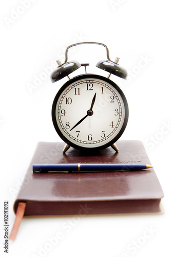 Notebook, pen and clock in retro style