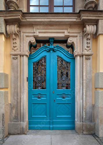 Traditional european facade with entance door photo