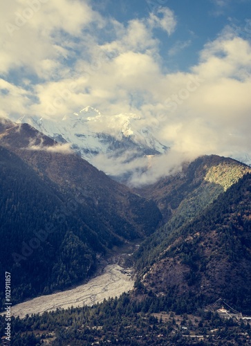 Mountains rising above valley.