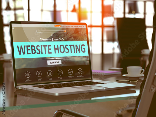 Website Hosting Concept. Closeup Landing Page on Laptop Screen  on background of Comfortable Working Place in Modern Office. Blurred, Toned Image. 3D Render. photo