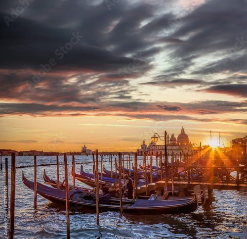 Venice with gondolas against colorful sunset in Italy © Tomas Marek