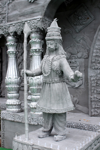 The guard in front of a temple made by iron net.
