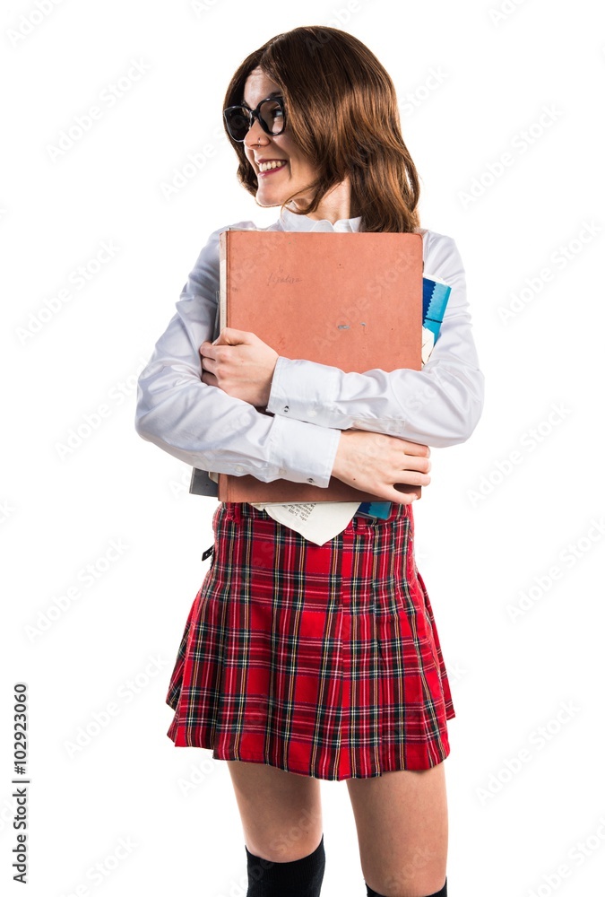 Student girl holding several college notes Student girl holding several college notes