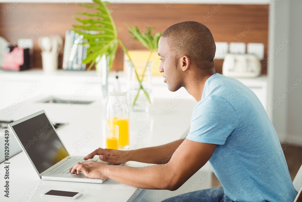 Young man using laptop Young man using laptop