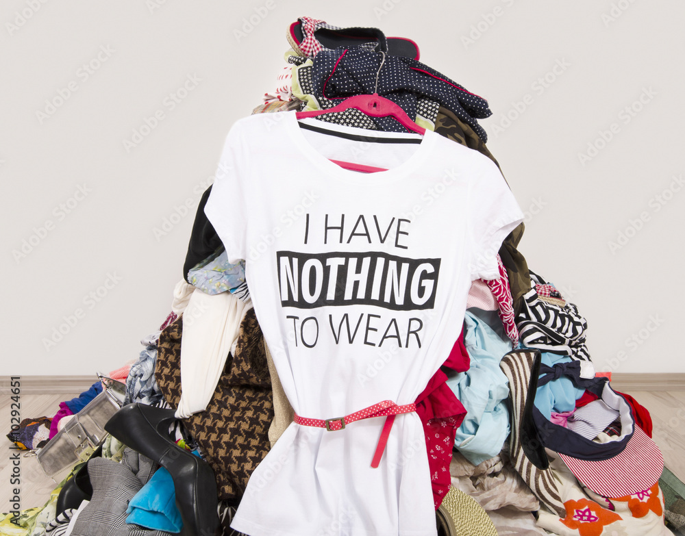 Big pile of clothes thrown on the ground with a t-shirt saying nothing ...