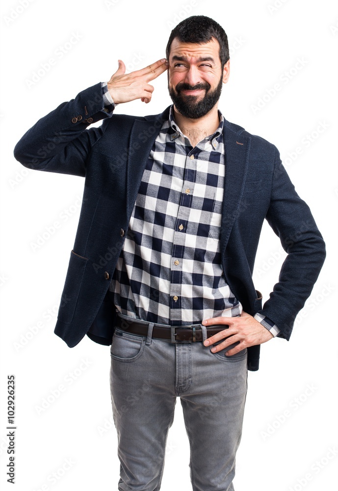 Handsome man making suicide gesture Handsome man making suicide gesture