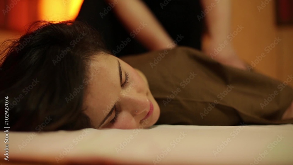 Brunette girl relaxes on the massage. Brunette girl relaxes on the massage.