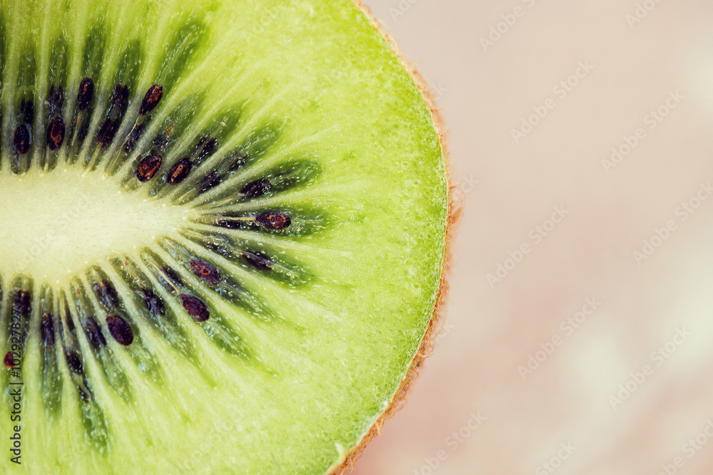 close up of ripe kiwi slice on table close up of ripe kiwi slice on table