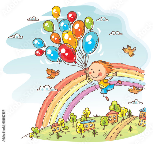 Happy child flying with the balloons
