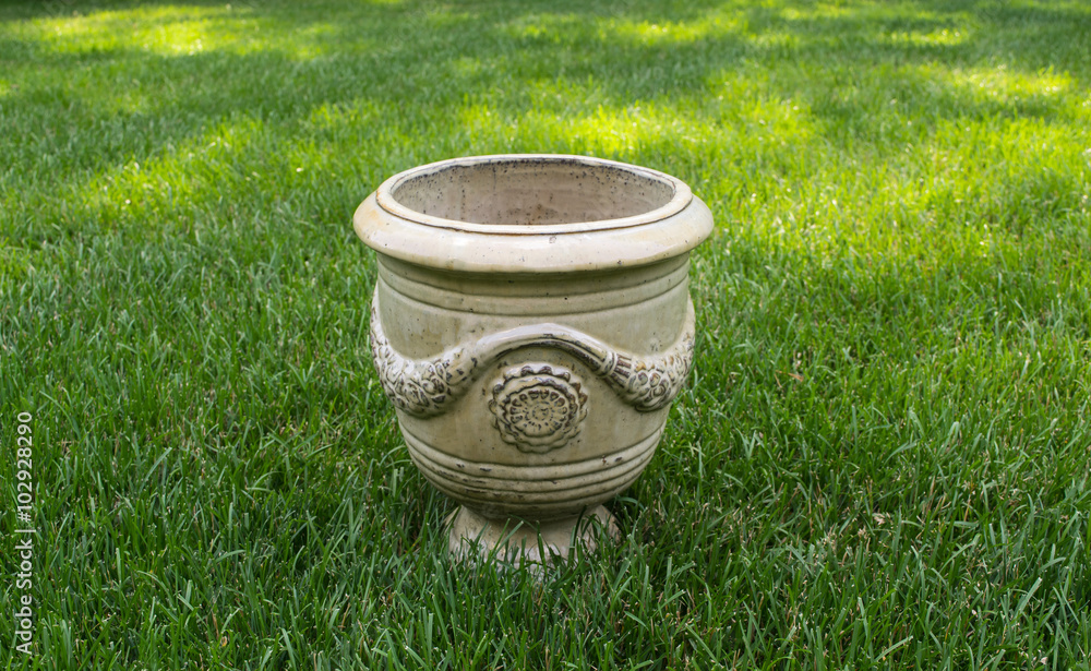 Planter in field of grass