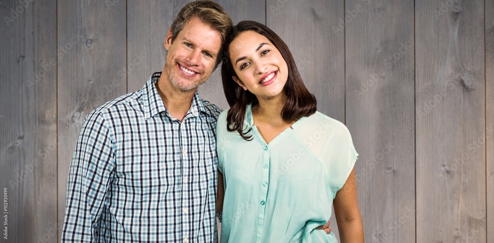 Composite image of portrait of happy couple standing Composite image of portrait of happy couple standing
