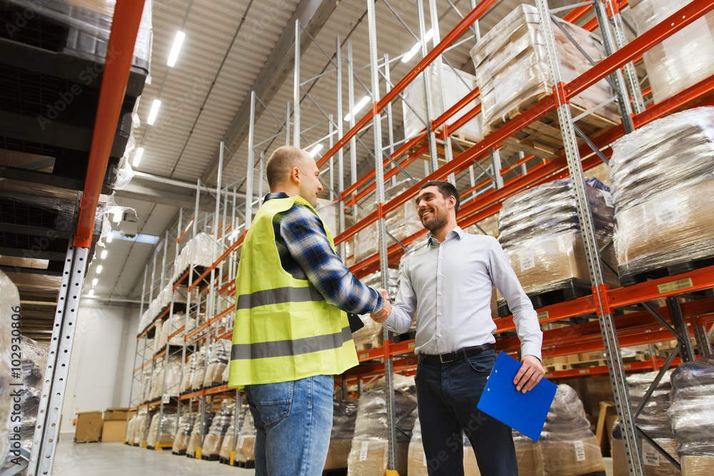 worker and businessmen with clipboard at warehouse worker and businessmen with clipboard at warehouse