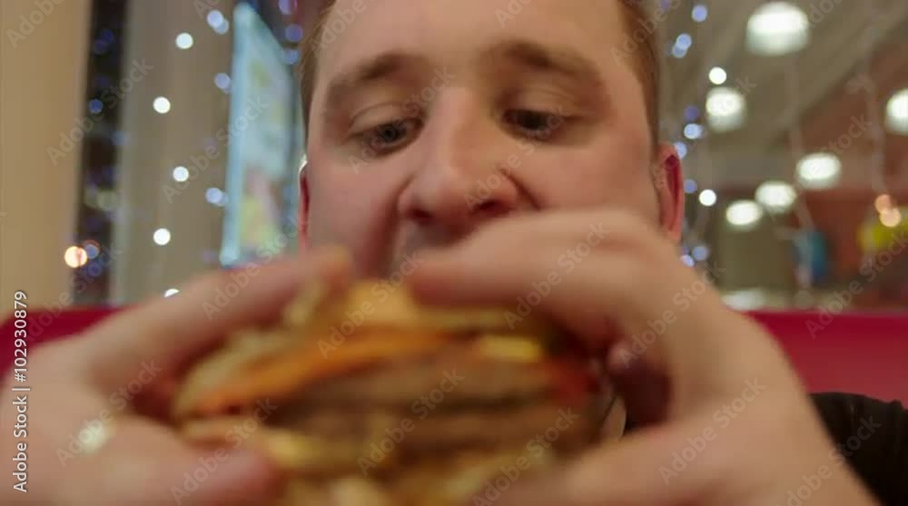 Hungry Man Eating Burger