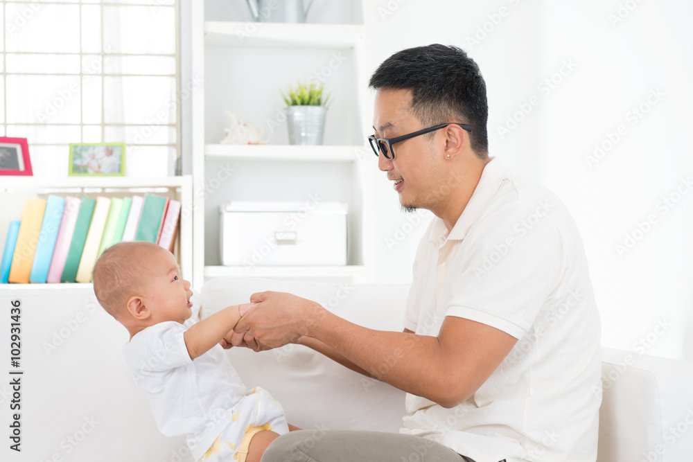 Asian father playing with baby Asian father playing with baby