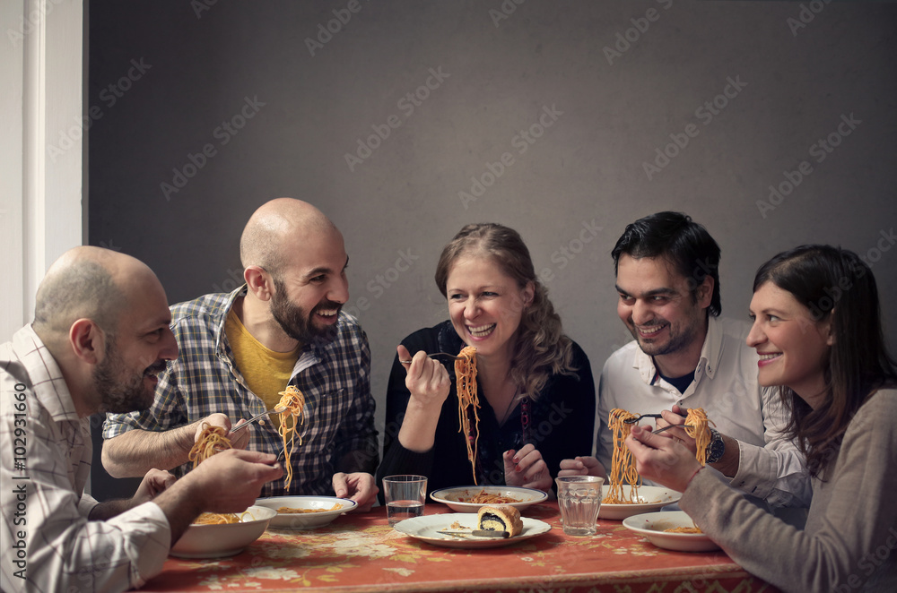 Friends eating pasta