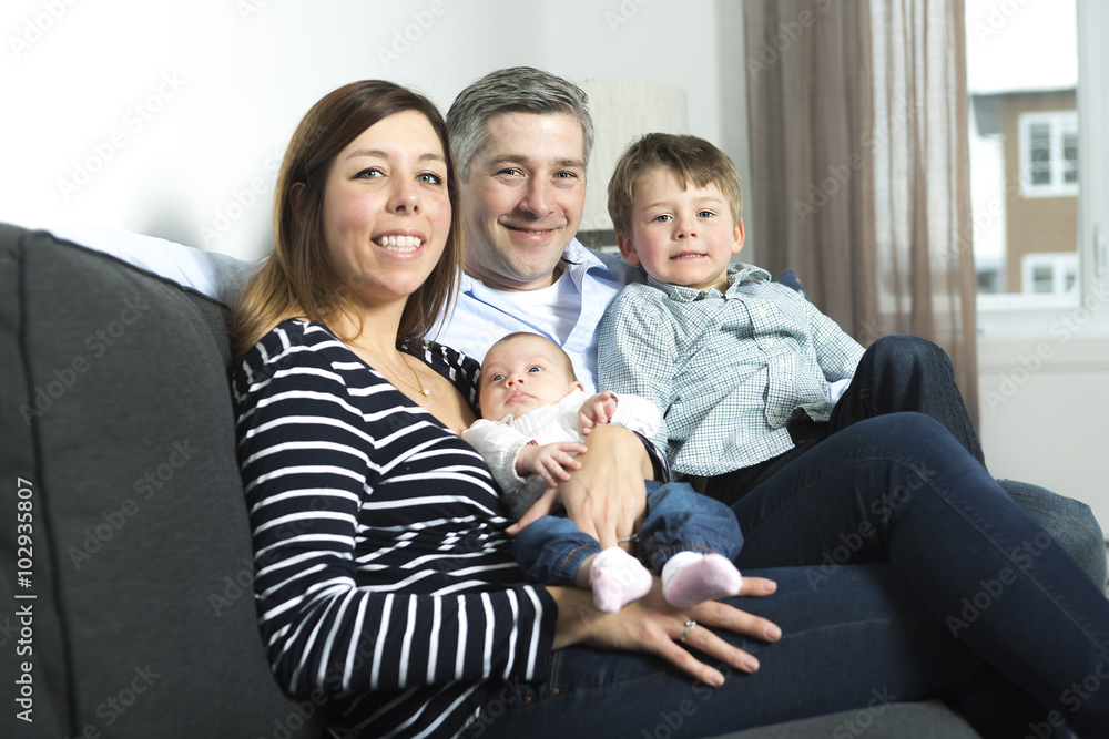 happy family mother, father and two children at home happy family mother, father and two children at home