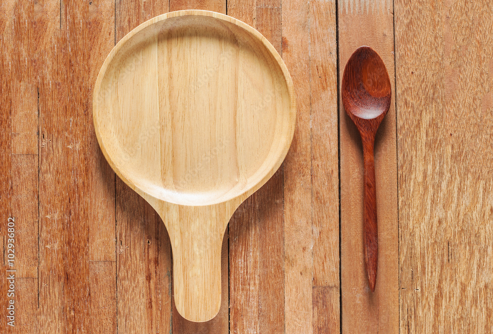 Brown bowl with spoon on table Brown bowl with spoon on table