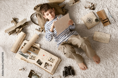 Boy in image traveler play in his room photo