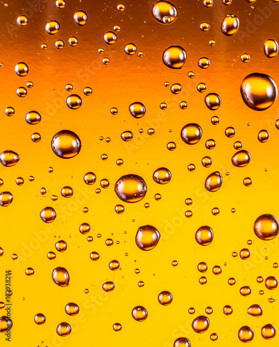 Water drops on glass of beer. Close up.