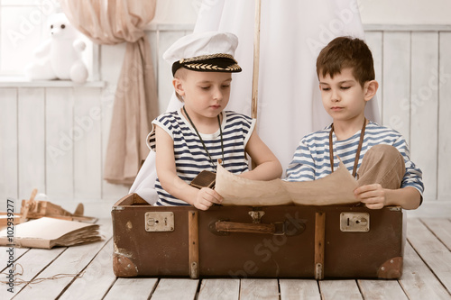 Boys in the image of sailors playing in her room