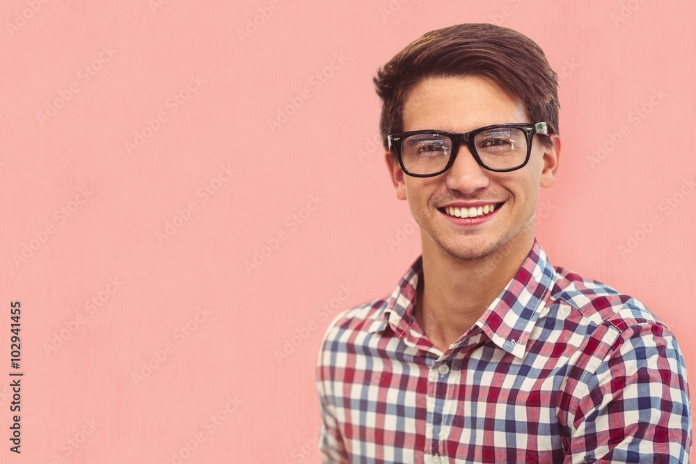 Composite image of young businessman smiling