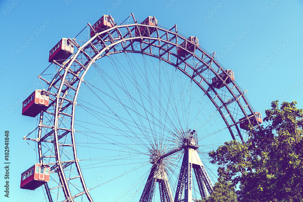 Retro Filter Of Fun Park Ferris Wheel Against Blue Sky In Vienna Prater Park