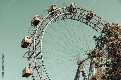 Photography Retro Filter Of Fun Park Ferris Wheel Against Blue Sky In Vienna Prater Park