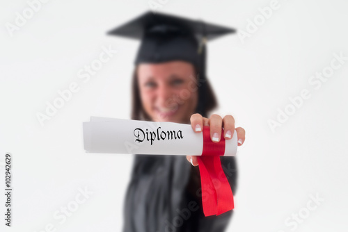 Out of Focus Happy Female Grad Holds Out Diploma Proudly