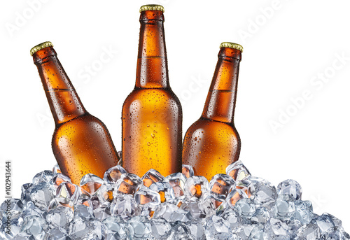 Cold bottles of beer in the ice cubes.