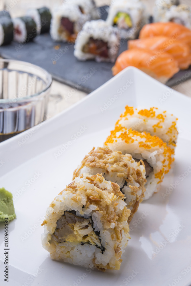 Salmon and caviar rolls served on a plate Salmon and caviar rolls served on a plate