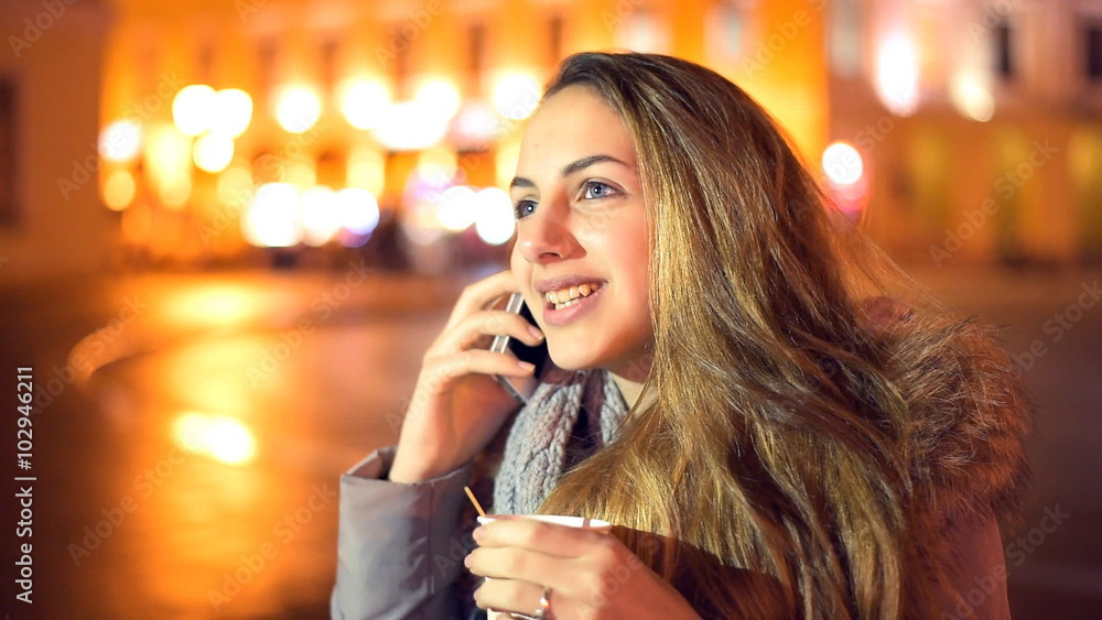 Beautiful young girl talking on a smartphone Beautiful young girl talking on a smartphone