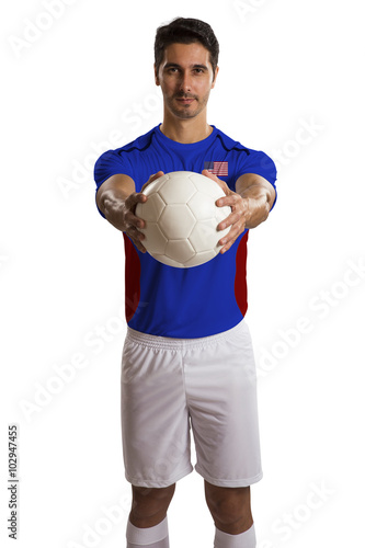 American soccer player holding ball on white background