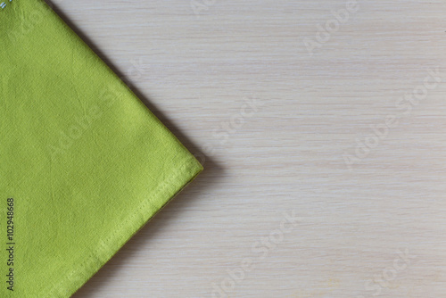 green napkin on a wooden table