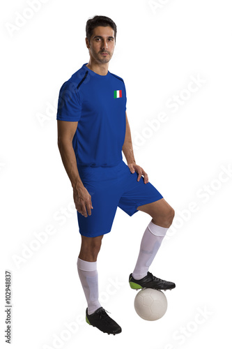 Italian soccer player holding ball on white background