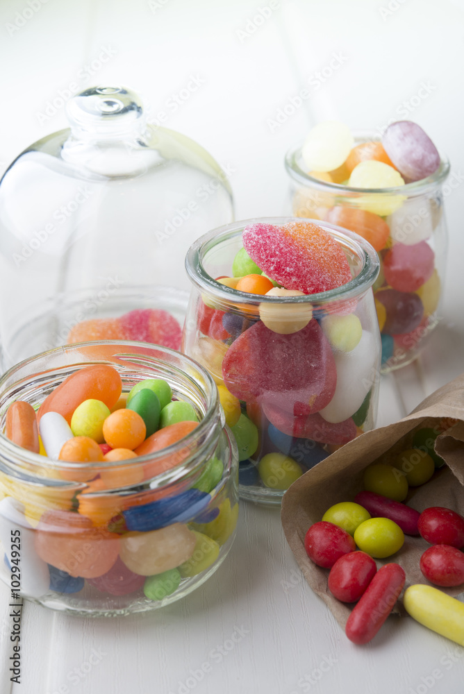 Multicolor candies in glass jars Multicolor candies in glass jars