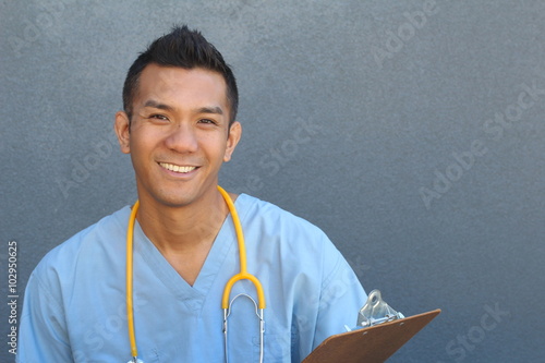 Smiling Asian male nurse with copy space on the right 