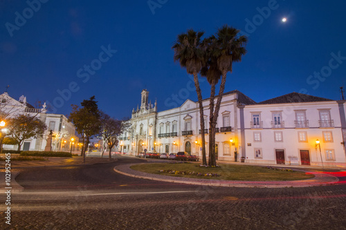 View of the main arch entrance to the historical town of Faro, Portugal at dawn.