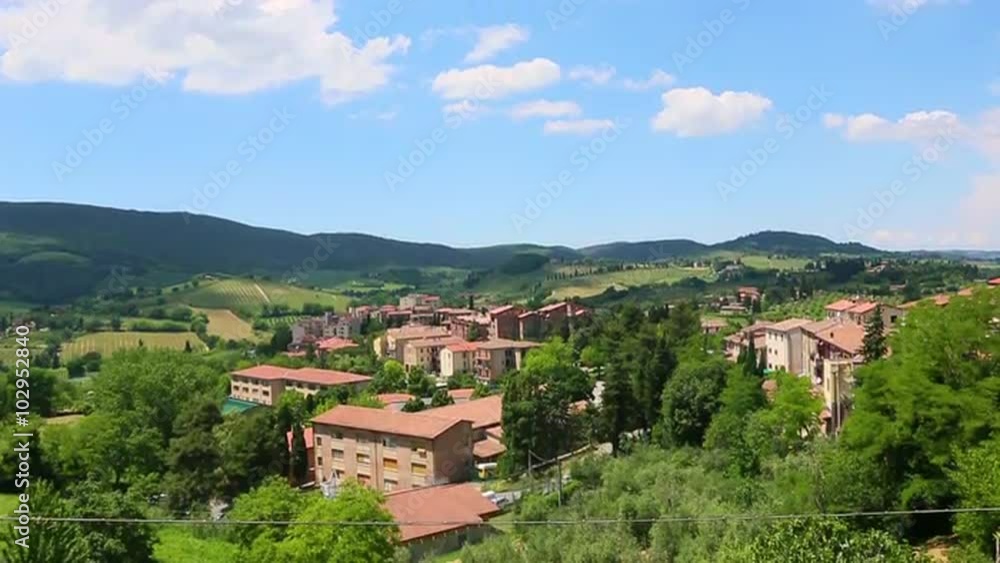 Tilt up shot of houses on a hill, San Gimignano, Province Of Siena, Tuscany, Italy Tilt up shot of houses on a hill, San Gimignano, Province Of Siena, Tuscany, Italy