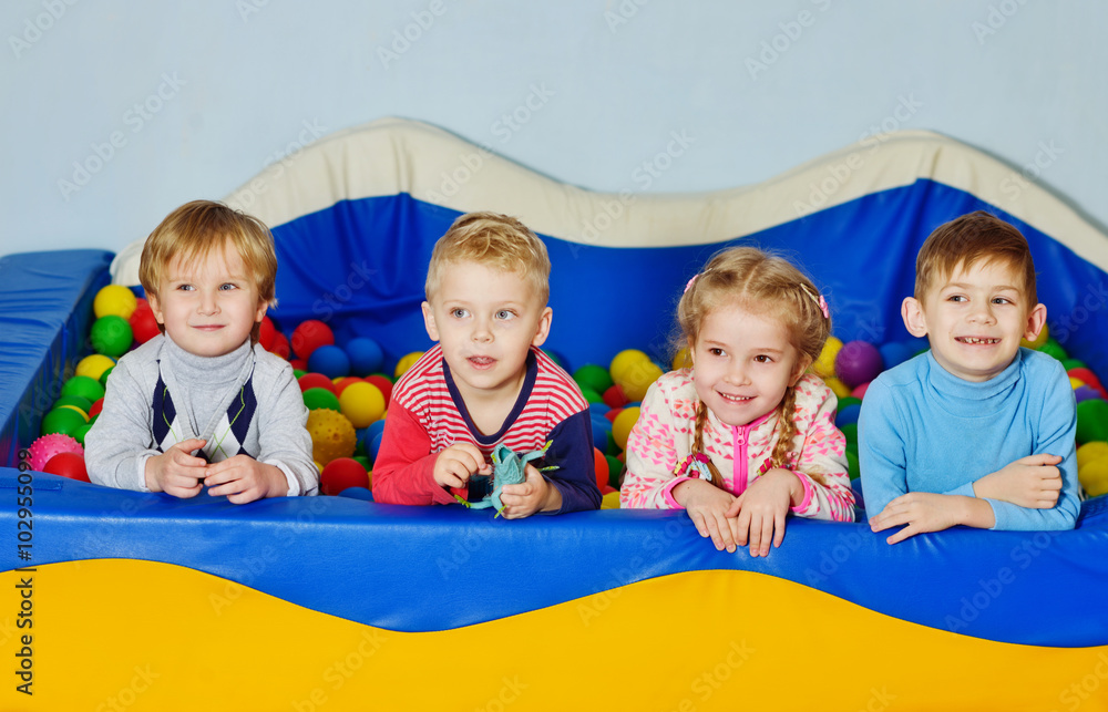children playing in pool with balls children playing in pool with balls