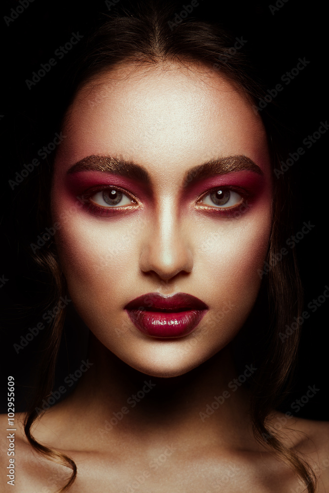 Close-up portrait of beautiful woman with bright make-up and hairstyle. Close-up portrait of beautiful woman with bright make-up and hairstyle.