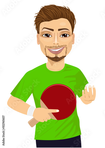 Confident young man holding table tennis racket and ball