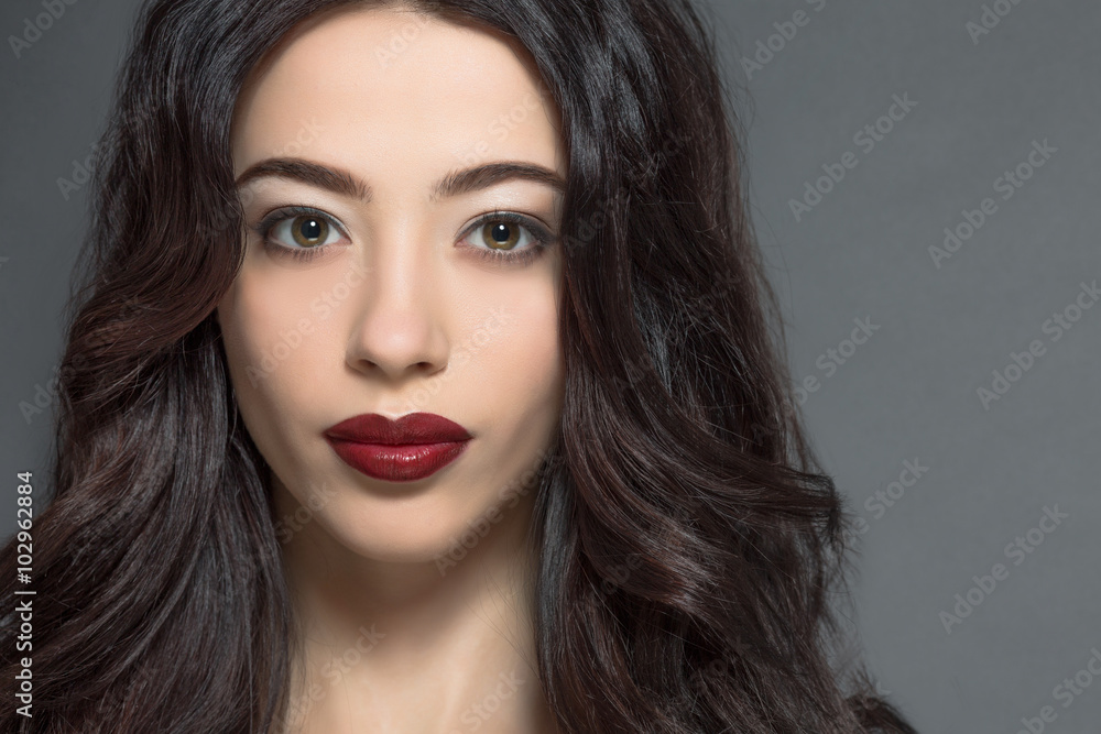 Fashion model woman with dark red lips in studio Fashion model woman with dark red lips in studio