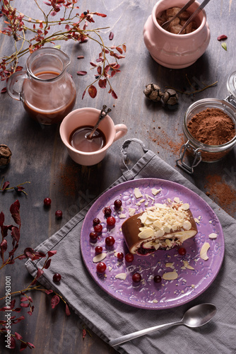 Delicious cake and cup of coffee on wooden background.